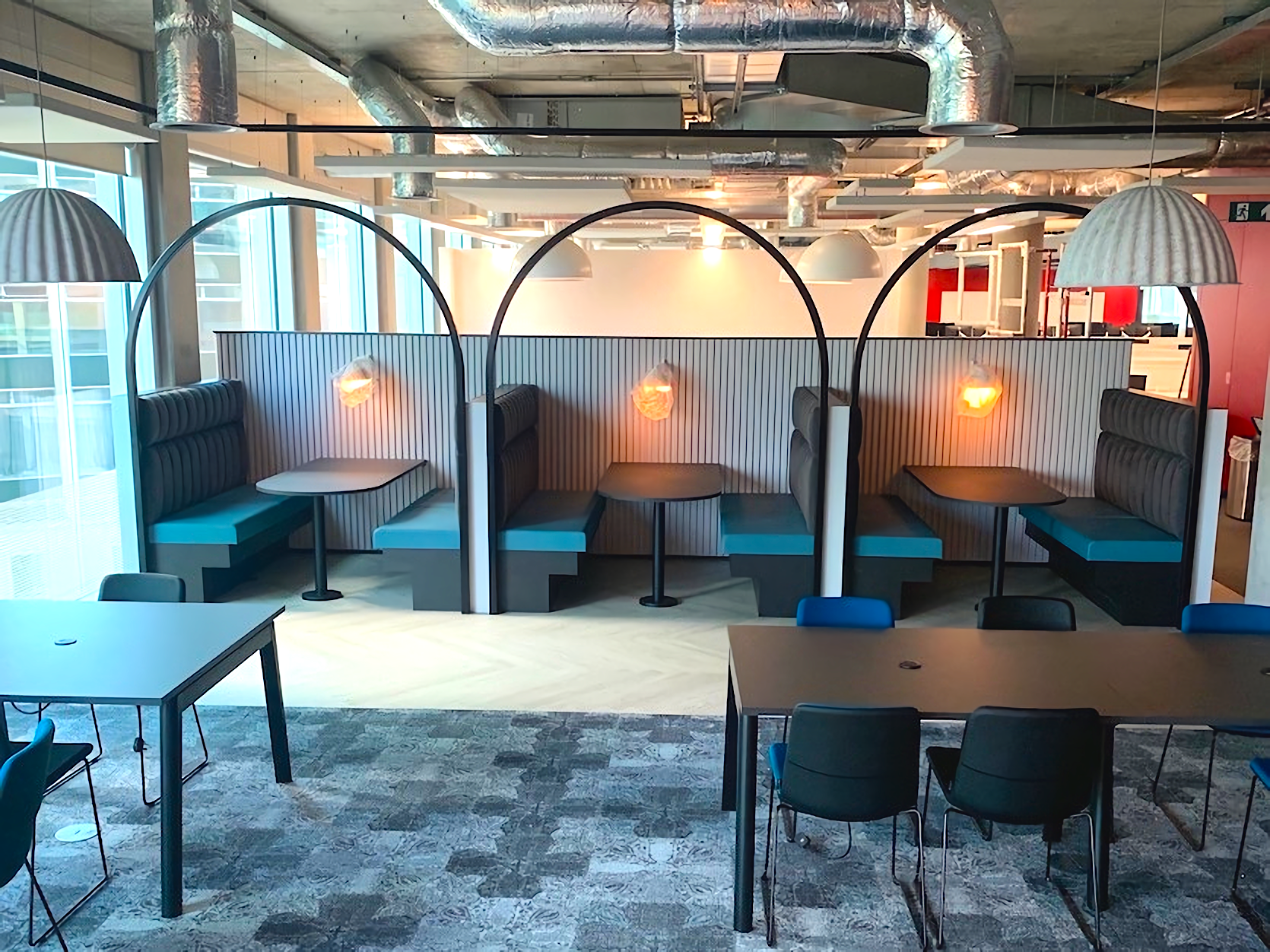 Bespoke seating booths featuring architectural hoops and banquette seating